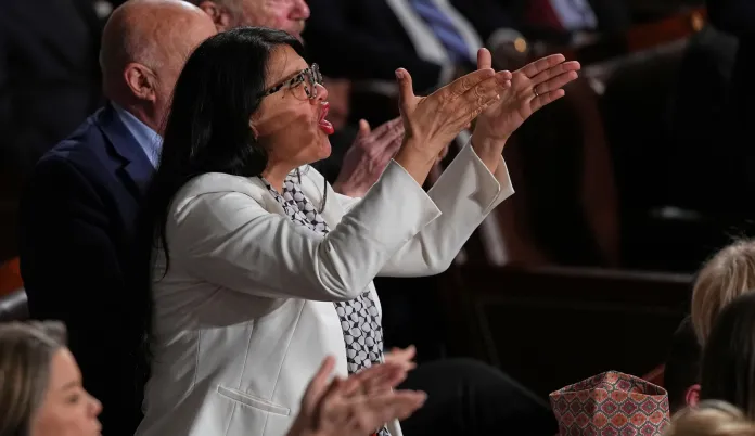 Rep. Rashida Tlaib, D-Mich., gestures as President Donald Trump delivers the State of the Union address to a joint session of Congress in the House chamber at the U.S. Capitol in Washington, Tuesday, Feb. 24, 2026. (AP Photo/Matt Rourke)