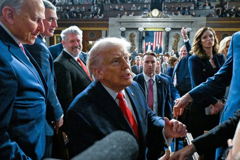 President Donald Trump exits the House chamber after delivering the State of the Union address to a joint session of Congress in the House chamber at the U.S. Capitol in Washington, Tuesday, Feb. 24, 2026. (Kenny Holston/The New York Times via AP, Pool)