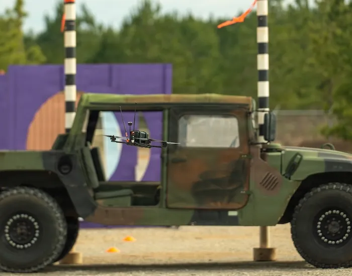 A drone is maneuvered through a HMMWV in a practice round during the U.S. Army Best Drone Warfighter Competition in Huntsville, AL, Feb. 17, 2026. Active Duty, Reserve, and National Guard Soldiers will compete for the top warfighter, showcasing their agility, adaptability, and lethality as they navigate the evolving modern battlefield. (U.S. Army photo by Austin Thomas)