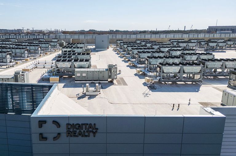 Cooling vent fans are seen on the roof of a Digital Realty data center in Ashburn, Virginia on November 12, 2025. (Photo by ANDREW CABALLERO-REYNOLDS / AFP via Getty Images)
