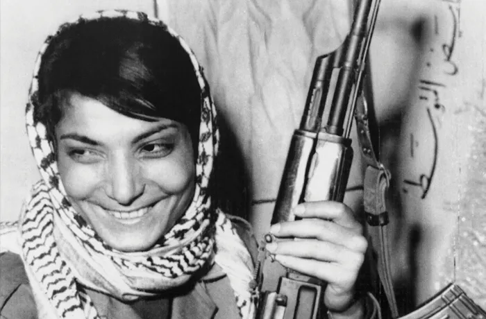 Leila Khaled, one of two hijackers of a TWA Flight 840, smiles after returning to her guerrilla base in Jordan on Oct. 17, 1969.(Getty Images)
