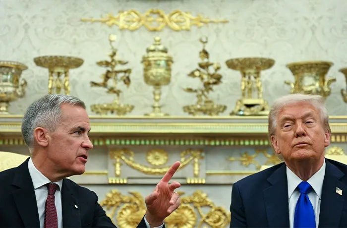 President Donald Trump meets with Canadian Prime Minister Mark Carney in the Oval Office of the White House in Washington, DC on October 7, 2025. (JIM WATSON/AFP via Getty Images)