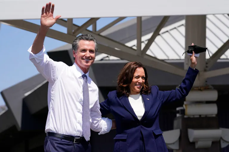 California Gov. Gavin Newsom and Vice President Kamala Harris wave during a campaign event at the IBEW-NECA Joint Apprenticeship Training Center in San Leandro, Calif., Wednesday, Sept. 8, 2021. (AP Photo/Carolyn Kaster)