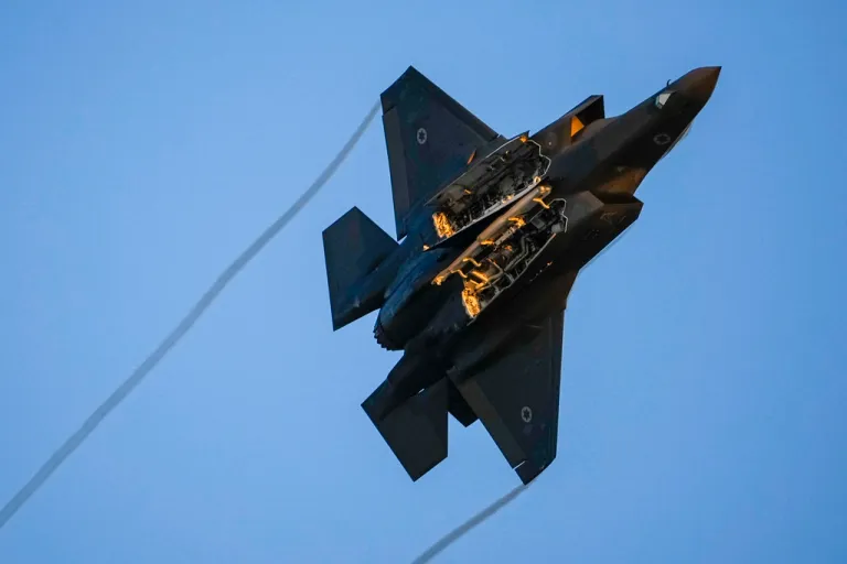 An Israeli air force F-35 war plane flies over during a graduation ceremony for new pilots in Hatzerim air force base near the southern Israeli city of Beersheba, Israel, Thursday, June 29, 2023. (AP Photo/Tsafrir Abayov)