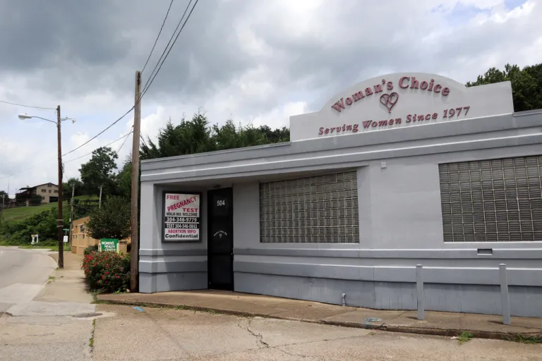 A sign advertises free pregnancy tests and abortion information outside the Woman's Choice Pregnancy Resource Center.