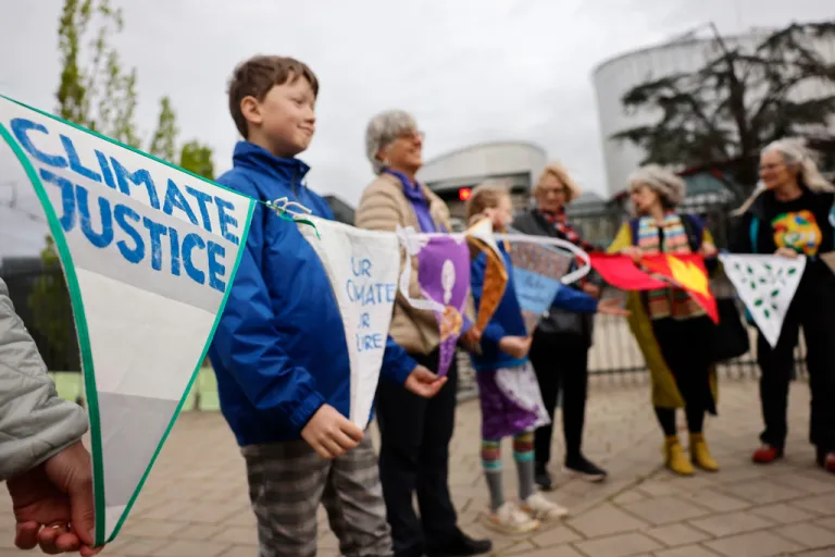 People demonstrate outside the European Court of Human Rights