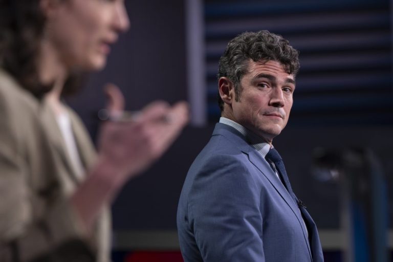 Republican candidate Joe Kent, right, looks on as Rep. Marie Gluesenkamp Pérez, D-Wash., speaks during a Washington 3rd District debate at KATU studios on Monday, Oct. 7, 2024.