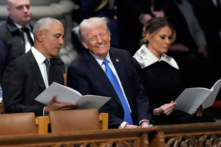 Former President Barack Obama talks with President-elect Donald Trump, next to Melania Trump.