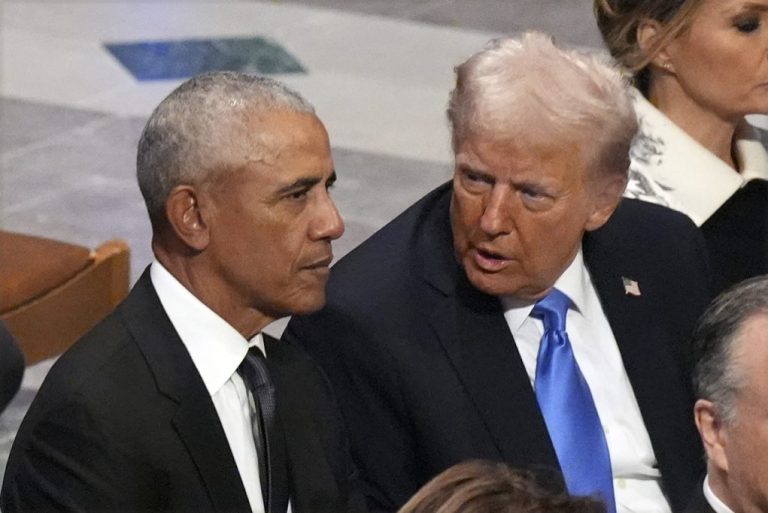 Former President Barack Obama talks with President-elect Donald Trump.