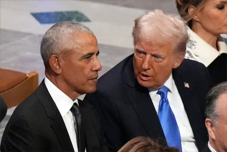 Former President Barack Obama talks with President-elect Donald Trump.
