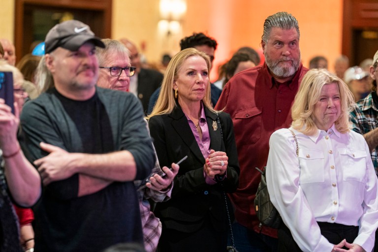 Wisconsin Chief Justice Annette Ziegler, center, watches as Wisconsin Supreme Court candidate Brad Schimel makes his concession speech to a crowd at his election night party Tuesday, April 1, 2025, in Pewaukee, Wis.