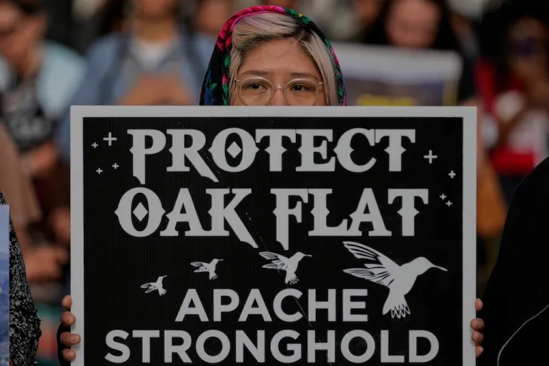 Members of Apache and others who want to halt a massive copper mining project on federal land in Arizona gather outside the U.S. District Court, Wednesday, May 7, 2025, in Phoenix. (AP Photo/Matt York)