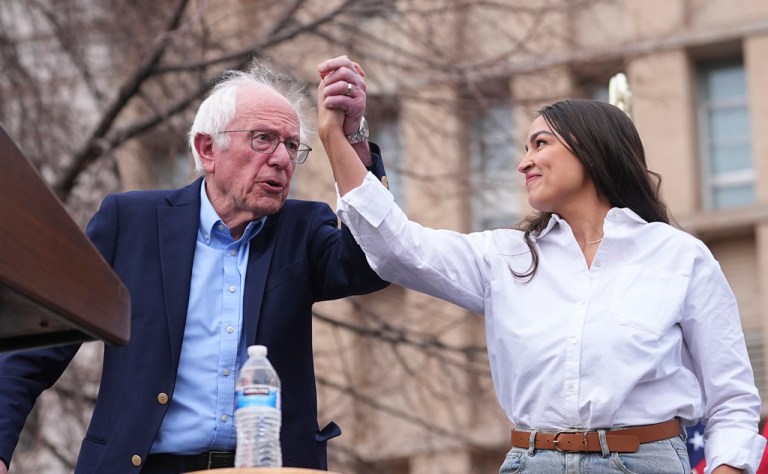 Sen. Bernie Sanders (I-VT) left, greets Rep. Alexandria Ocasio-Cortez (D-NY).