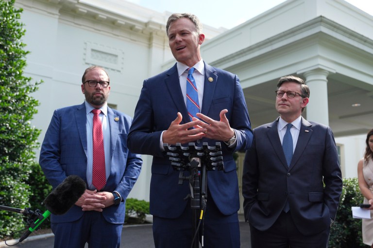 Rep. Blake Moore (R-UT) speaks with members of the media as Rep. Jason Smith (R-MO) and House Speaker Mike Johnson (R-LA) listen outside the West Wing in June 2025.