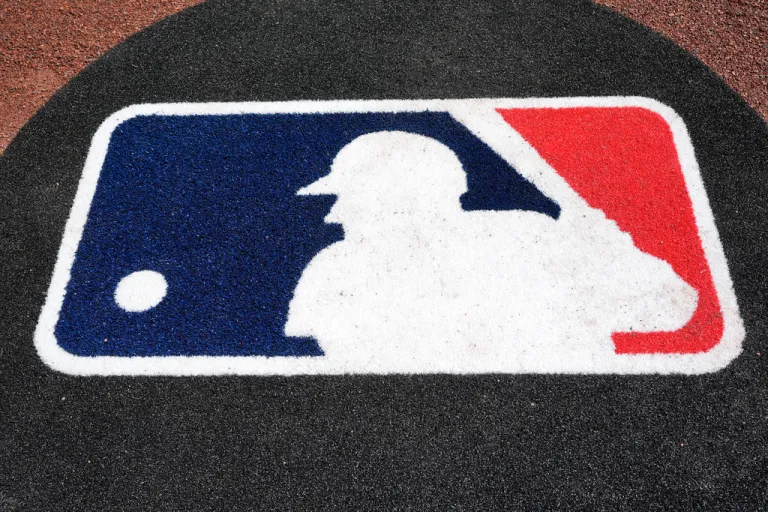 FILE - The Major League Baseball logo is seen on the field before a spring training baseball game between the Pittsburgh Pirates and the Atlanta Braves Tuesday, Feb. 27, 2024, in Bradenton, Fla. (AP Photo/Charlie Neibergall, file)