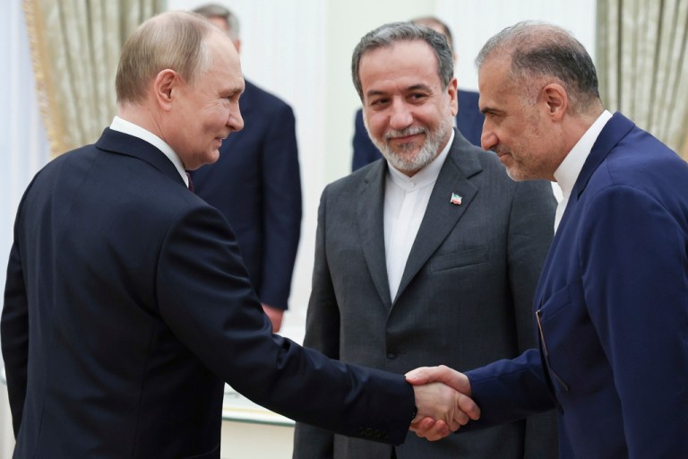 Russian President Vladimir Putin, left, greets Ambassador of Iran to Russia Kazem Jalali, right, and Iranian Foreign Minister Abbas Araghchi, center, prior to their talks at the Kremlin in Moscow, Russia, Monday, June 23, 2025. (Alexander Kazakov, Sputnik, Kremlin Pool Photo via AP)