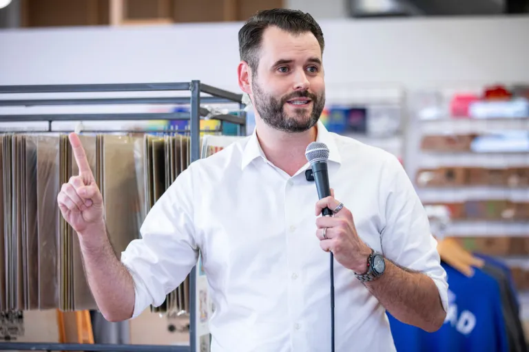 Iowa State Senator and candidate for the Democratic nomination for U.S. Senate Zach Wahls speaks during a campaign event at RAYGUN Shirts store in Cedar Rapids, Iowa on Thursday, Sept, 11, 2025. (Nick Rohlman/The Gazette via AP)