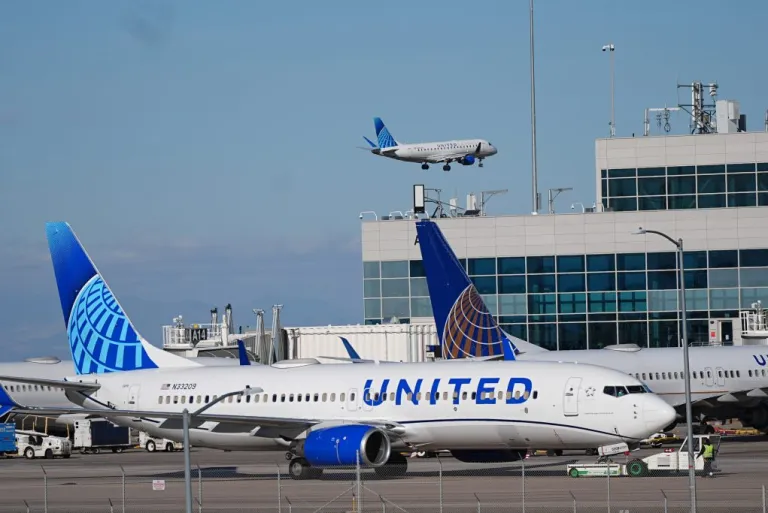 United Airlines jetliner is pushed off a gate on the A concourse for take off from Denver International Airport.