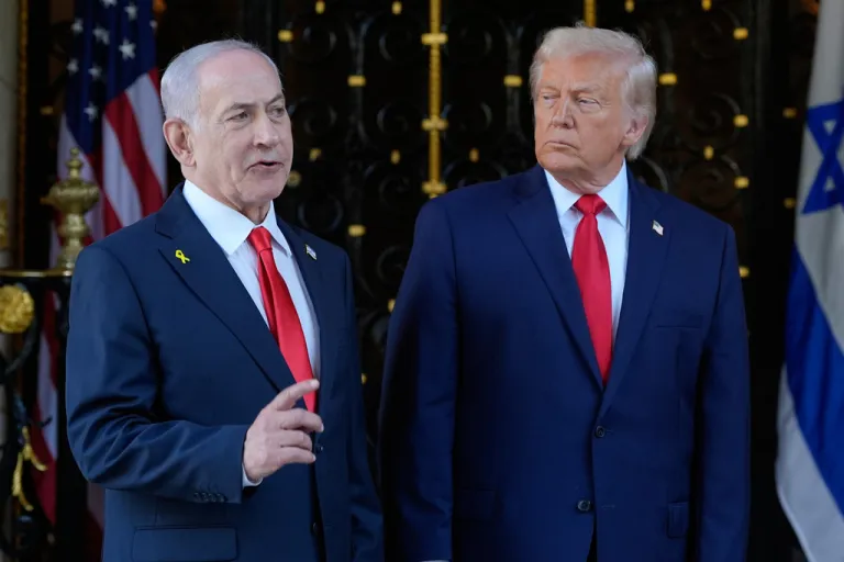 President Donald Trump listens as Israel's Prime Minister Benjamin Netanyahu speaks during an arrival at his Mar-a-Lago club, Monday, Dec. 29, 2025, in Palm Beach, Fla. (AP Photo/Alex Brandon)