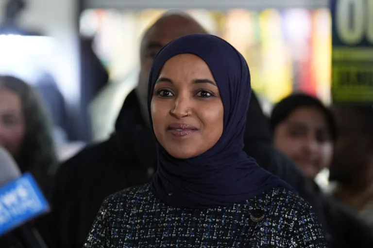 Rep. Ilhan Omar, D-Minn., stands during a press conference.