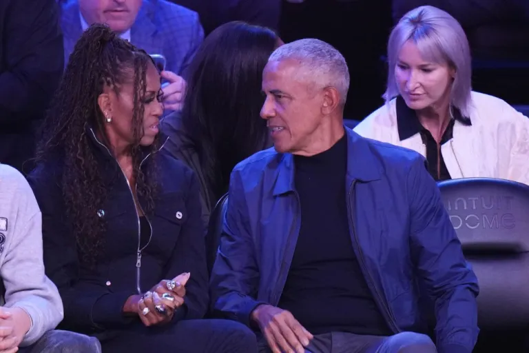 Barack and Michelle Obama attend the NBA All-Star basketball game.