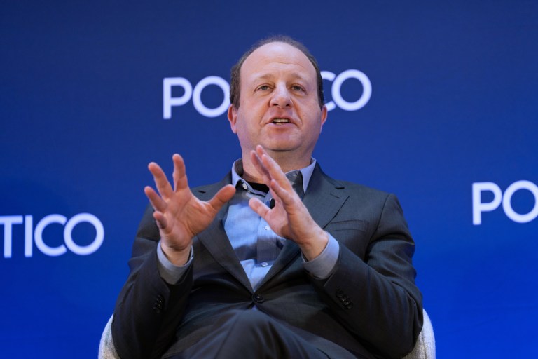 Jared Polis speaks at an event at the National Governors Association