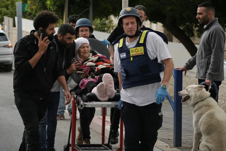 Paramedics evacuate wounded people from the site of a deadly Iranian missile strike in Beit Shemesh, Israel