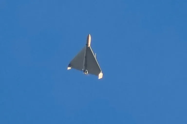 An Iranian Shahed exploding drone launched by Russia flies through the sky seconds before it struck buildings in Kyiv, Ukraine,