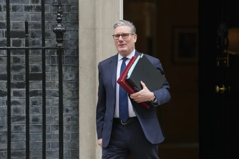 Britain's Prime Minister Keir Starmer leaves 10 Downing Street to attend the weekly Prime Ministers' Questions session in the parliament in London, England, Wednesday, March 4, 2026. (AP Photo/Kin Cheung)