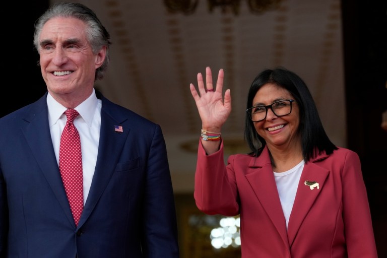 Venezuela's acting President Delcy Rodriguez, right, and U.S. Interior Secretary Doug Burgum smile after a meeting at Miraflores presidential palace in Caracas, Venezuela, Wednesday, March 4, 2026. (AP Photo/Ariana Cubillos)