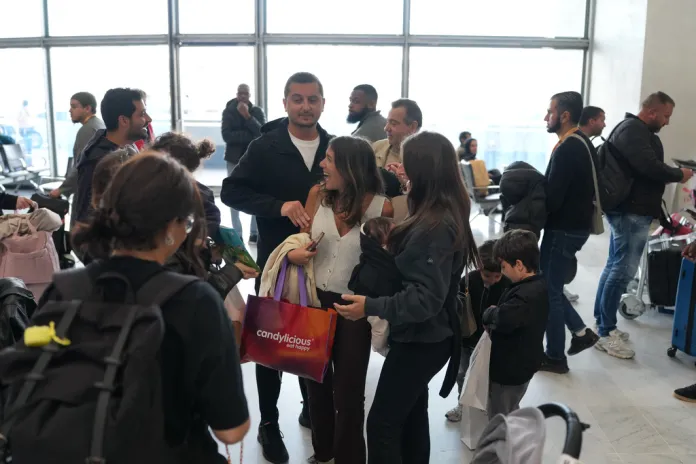 Passengers from Dubai arrive at Charles Degaulle Airport in France