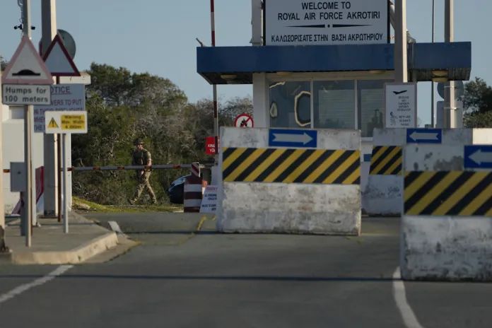 A British soldier guards at the main gate of the U.K.'s RAF Akrotiri.