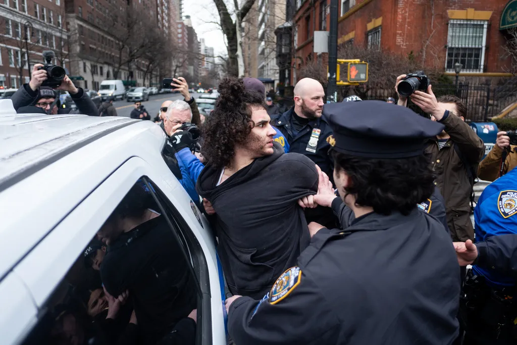 Police detain Emir Balat after he attempted to detonate an improvised explosive device during a counterprotest against far right influencer Jake Lang staging an anti-Islam protest outside Gracie Mansion