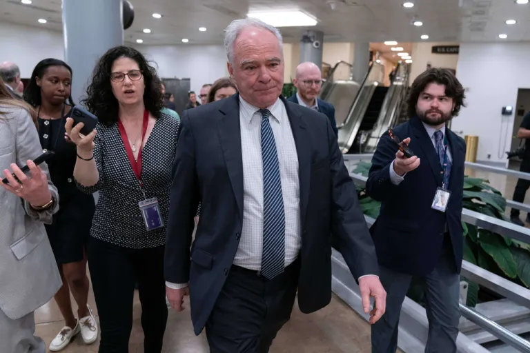 Sen. Tim Kaine leaves after a closed door briefing on the Iran war