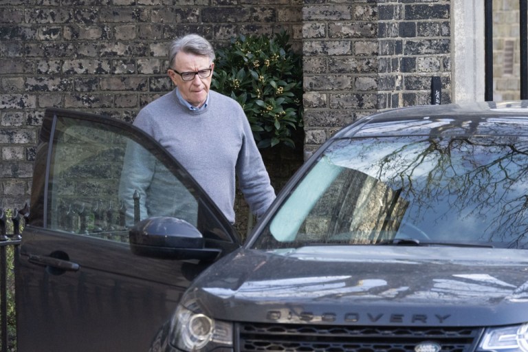 Mandelson enters his car at his home in London