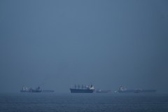 Three cargo ships damaged by projectiles in Strait of Hormuz