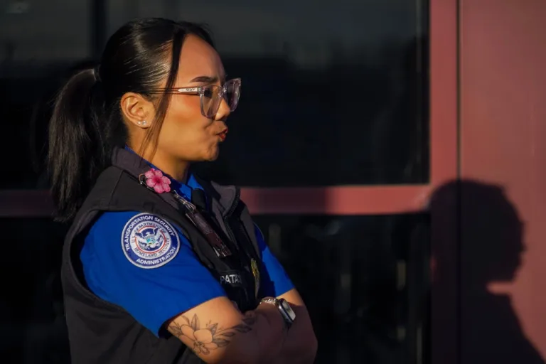 A TSA staff member waits to unload donated lunches from MGM Resorts during a partial government shutdown at the Harry Reid International Airport in Las Vegas, Wednesday, March 11, 2026. (AP Photo/Ty ONeil)
