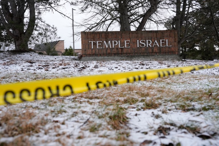Police tape hangs outside the Temple Israel synagogue.