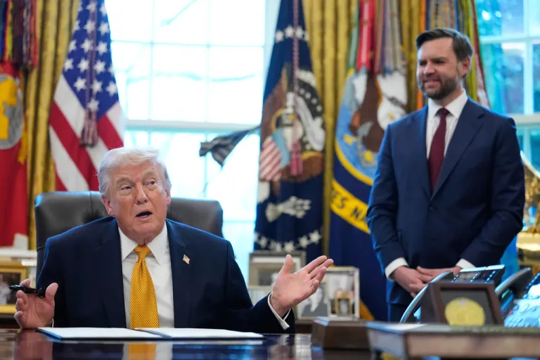President Donald Trump speaks before signing an executive order regarding a task force on fraud in the Oval Office of the White House, Monday, March 16, 2026, in Washington, as Vice President JD Vance listens.