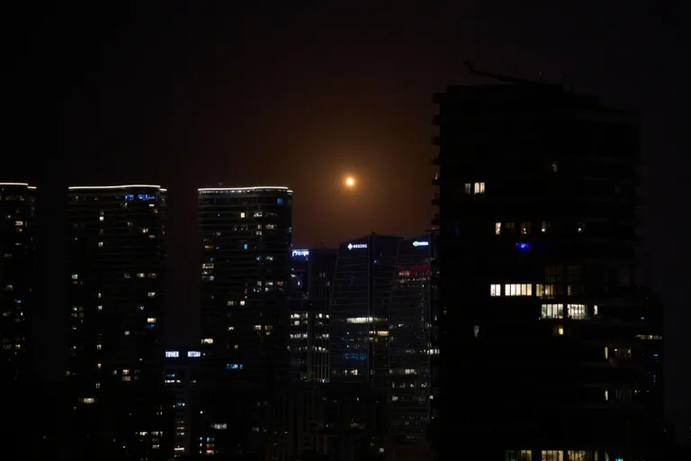 Missiles launched from Iran streak across the sky over central Israel