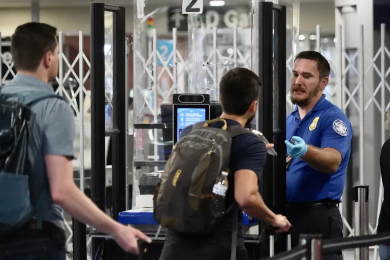 A TSA staff member at a check point at Harry Reid International Airport