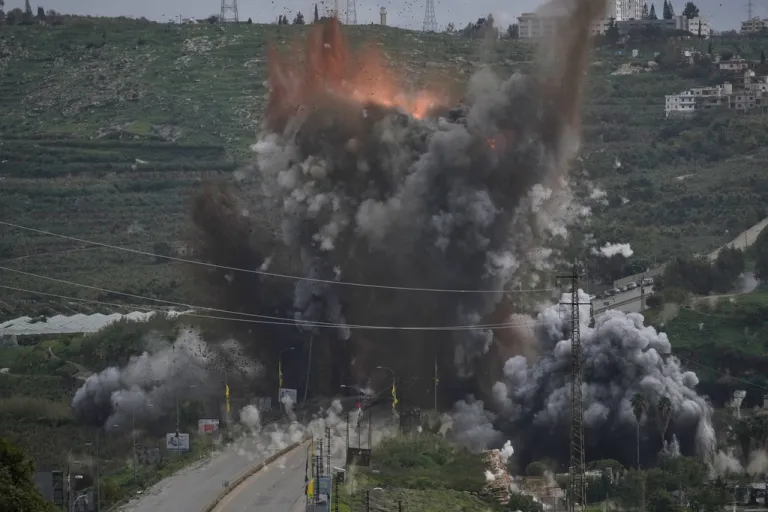 A smoke plume and flames rise from an Israeli airstrike.