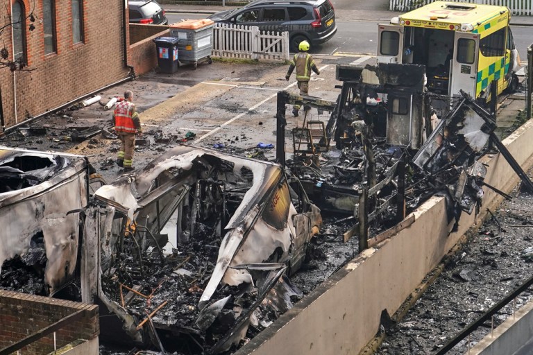 Four burnt-out ambulances in Golders Green are investigated by responders.