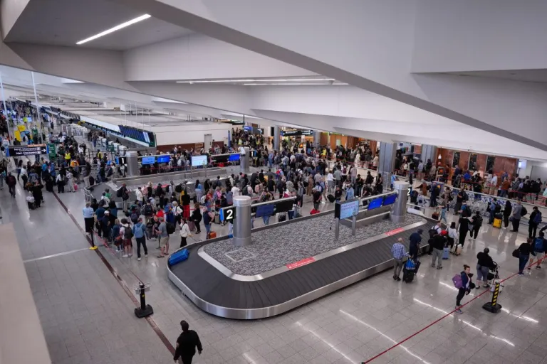 People wait in a TSA line at the Hartsfield-Jackson Atlanta International Airport