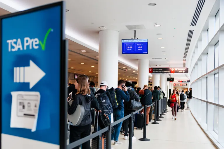 People wait in a TSA line at Philadelphia International Airport.