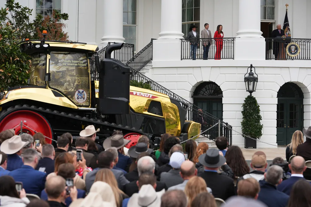 President Donald Trump speaks during an event with farmers while Agriculture Secretary Brooke Rollins, left, listens on the South Lawn of the White House, Friday, March 27, 2026, in Washington. (AP Photo/Julia Demaree Nikhinson)