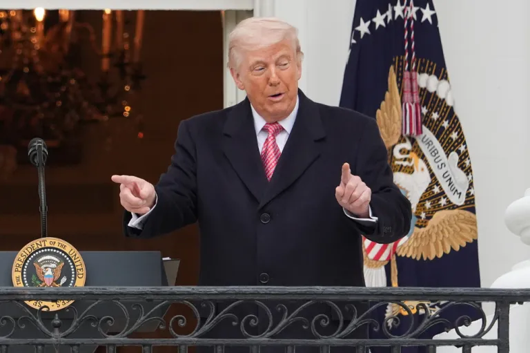 President Donald Trump points at tractors during an event with farmers on the South Lawn of the White House, Friday, March 27, 2026, in Washington.