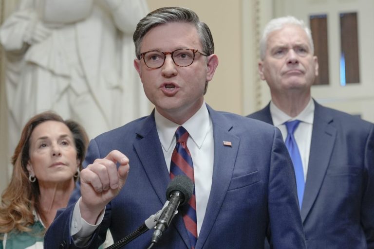 Speaker of the House Mike Johnson, R-La., center, speaks while House Majority Whip Tom Emmer R-Minn., right, and House Republican Conference Chair Lisa McClain, R-Mich., left, listen.