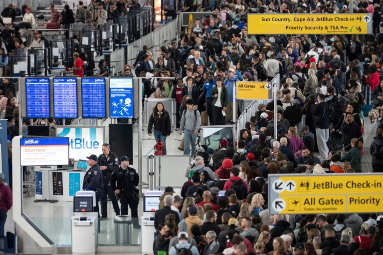 People wait in a TSA line at the John F. Kennedy International Airport, March 22, 2026, in New York. (AP Photo/Yuki Iwamura, File)