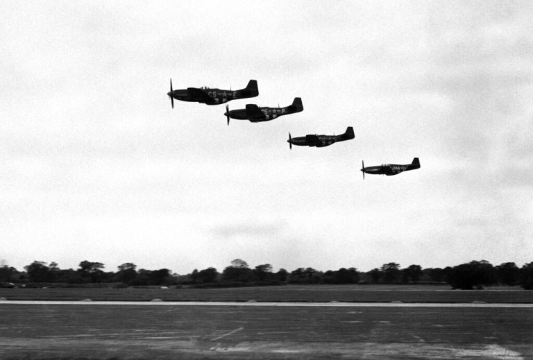 P 51 Mustangs leave their base, somewhere in England, to escort Flying Fortresses on a raid over Germany